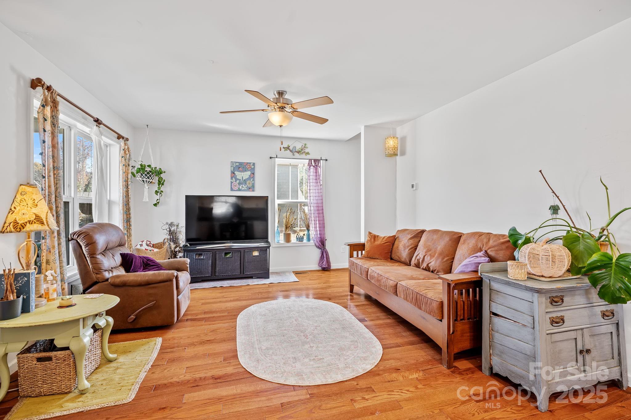 28 Yarrow Meadow Road Weaverville, NC 28787 - Photo 4 of 29 a living room with furniture and a flat screen tv