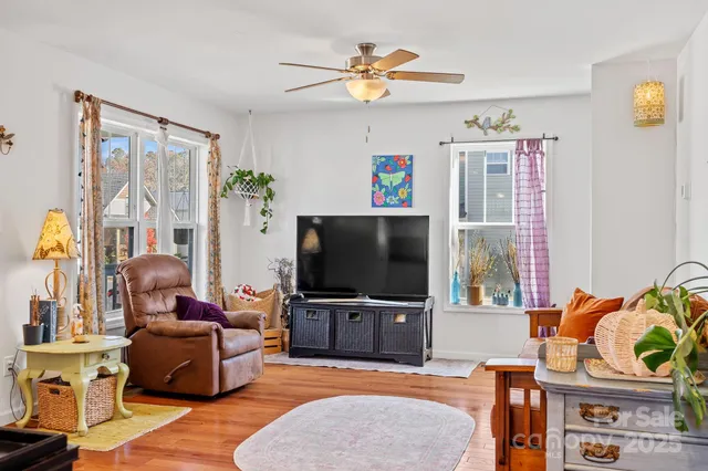 a living room with furniture and a flat screen tv