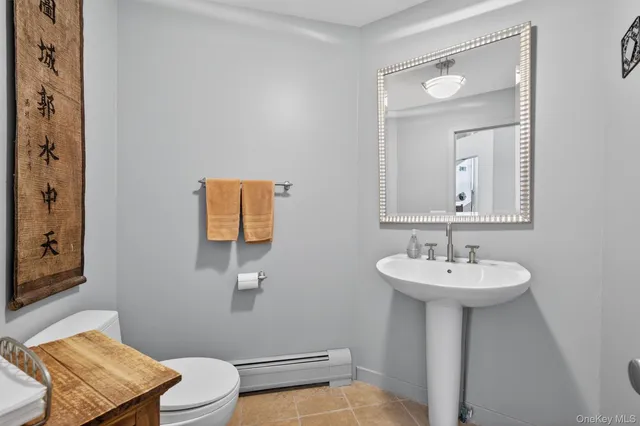 a kitchen with a refrigerator and a sink