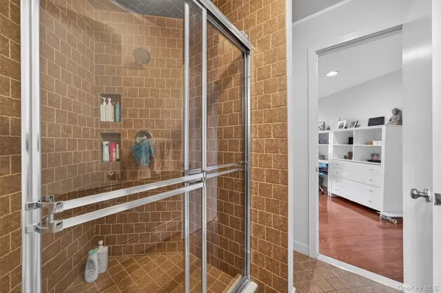 a view of entryway with wooden floor and stairs