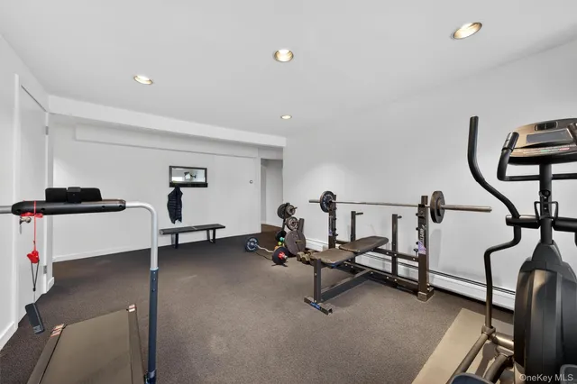 a bathroom with a double vanity sink toilet and mirror