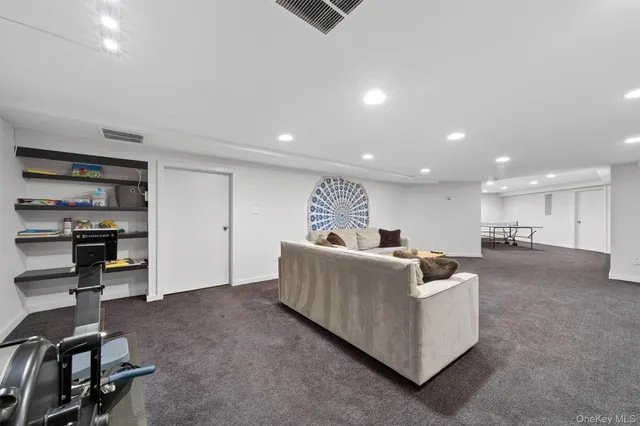 a view of parking garage with cars parked