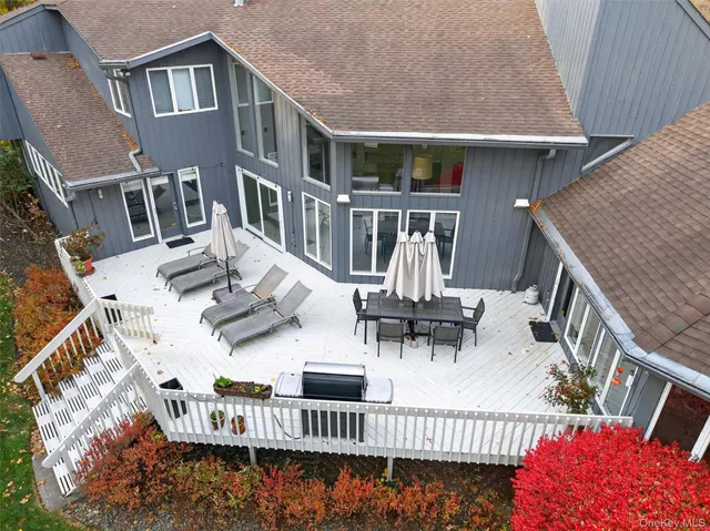 a front view of a house with garden and porch