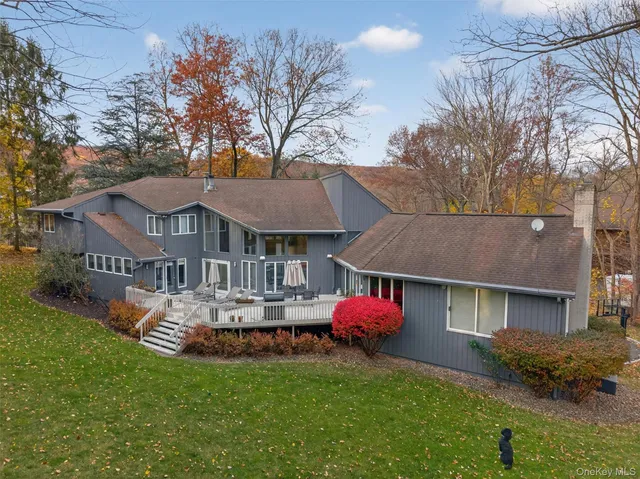 an aerial view of a house with a yard and garden