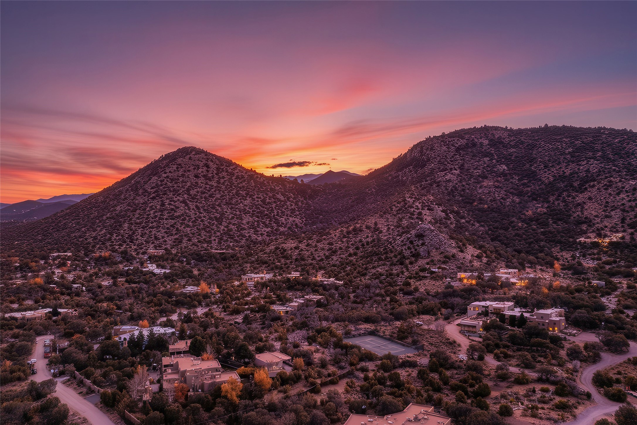2022 Foothills Road Santa Fe, NM 87505 - Photo 65 of 68 Sunset View of Property & Sun and Moon Mountain