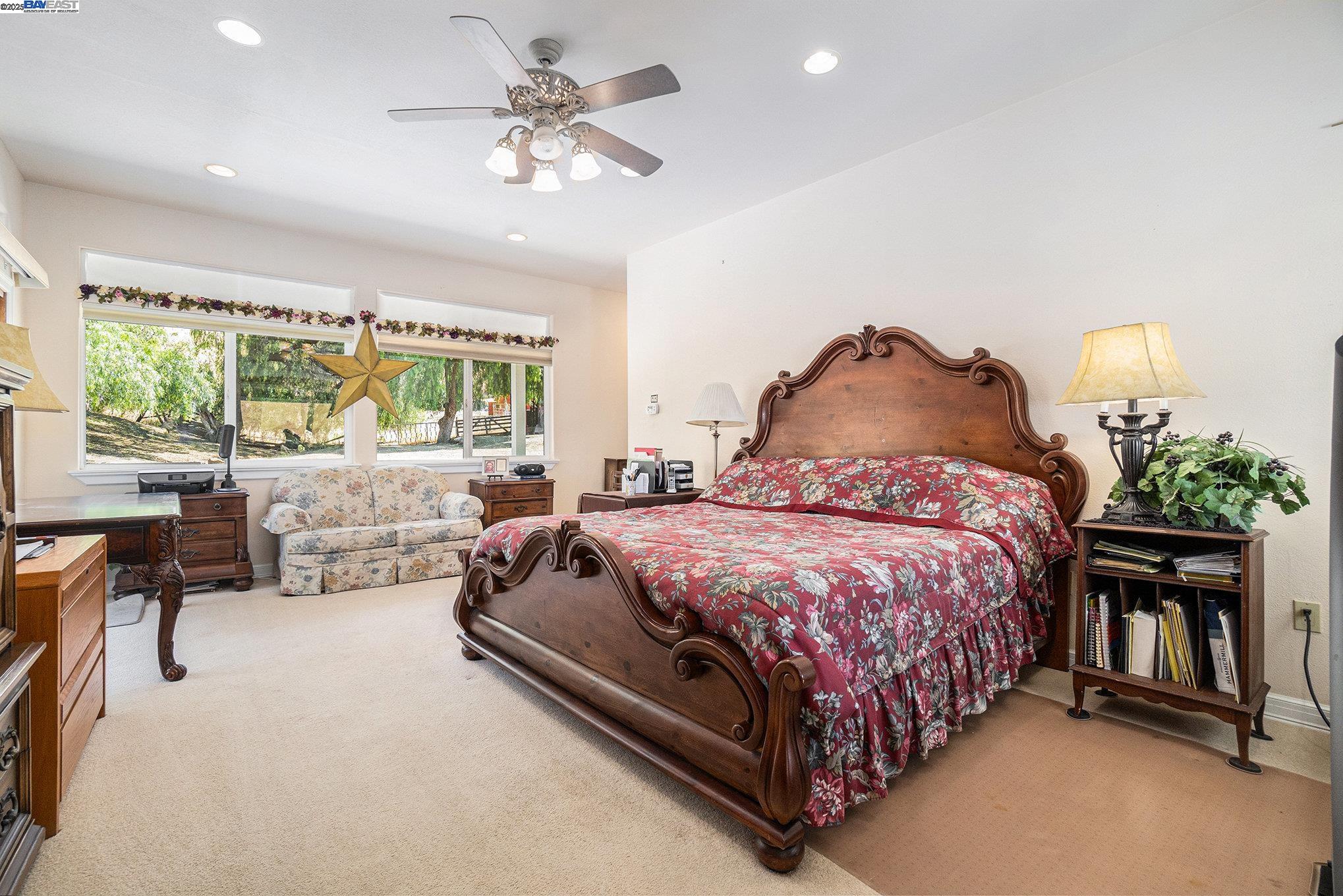 5799 Nortonville Road Pittsburg, CA 94565 - Photo 22 of 59 a spacious bedroom with a bed and a chandelier