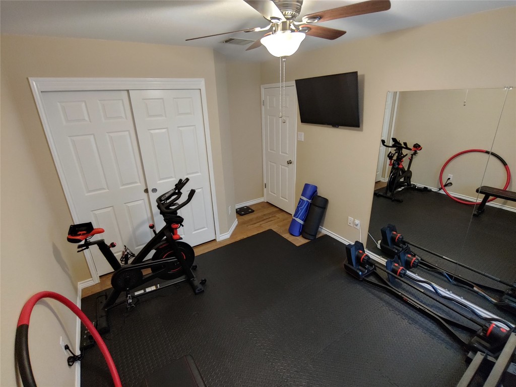 8124 Tockington Way Austin, TX 78748 - Photo 19 of 28 a view of a room with gym equipment