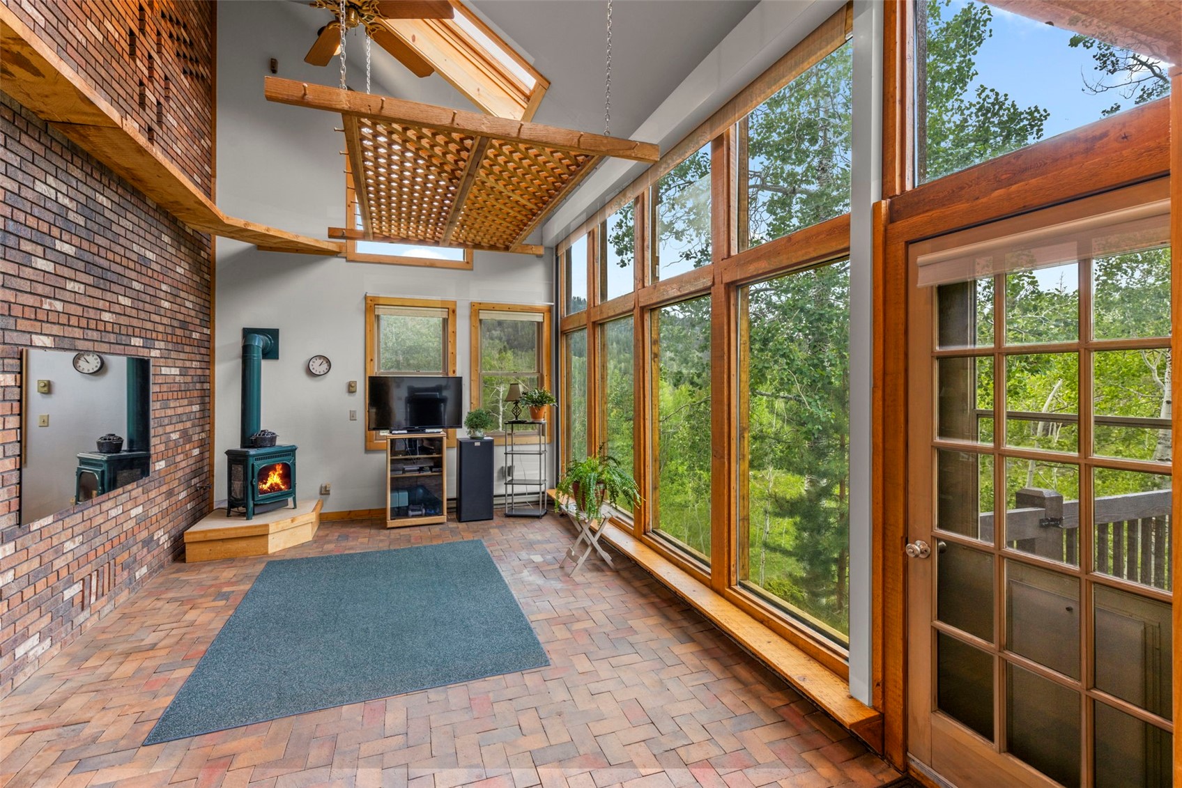1516 Blue Ridge Road Silverthorne, CO 80498 - Photo 33 of 50 Sunroom with a wood stove