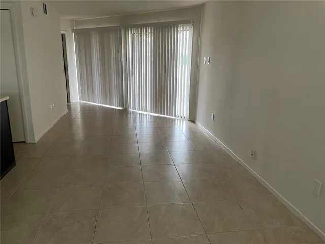 a view of a livingroom with wooden floor