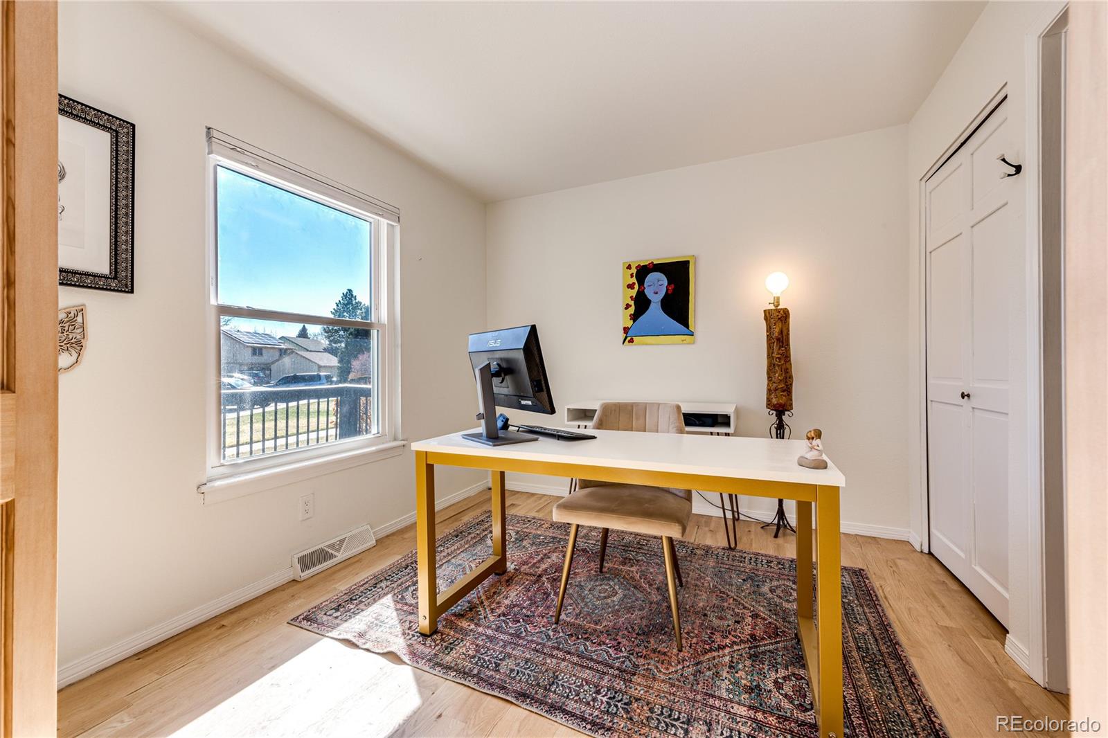 8712 Independence Way Arvada, CO 80005 - Photo 12 of 40 a work room with furniture a rug and a window