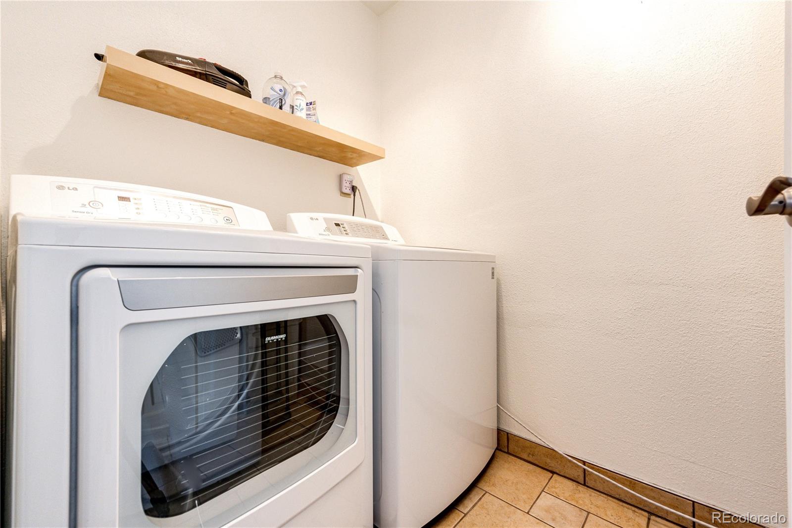 8712 Independence Way Arvada, CO 80005 - Photo 14 of 40 a close up view of washer and dryer
