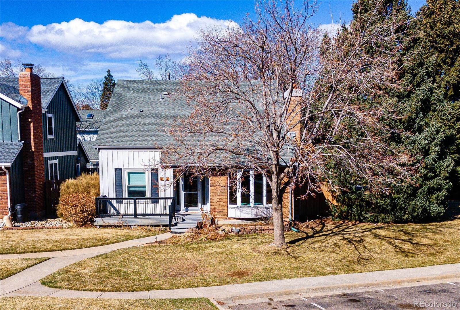 8712 Independence Way Arvada, CO 80005 - Photo 2 of 40 a view of a house with snow on the side of the road