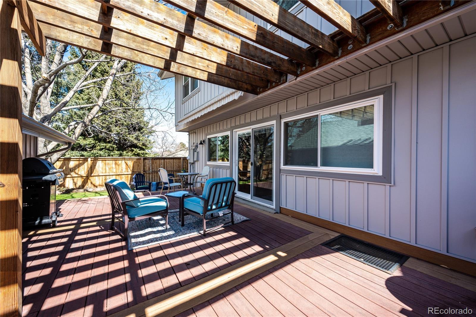 8712 Independence Way Arvada, CO 80005 - Photo 29 of 40 a view of a patio with a table and chairs