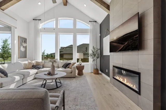 a living room with fireplace furniture and a flat screen tv