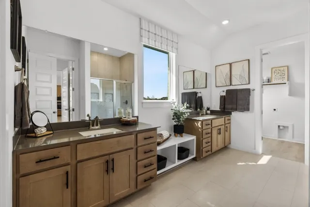 a spacious bathroom with a granite countertop sink mirror and