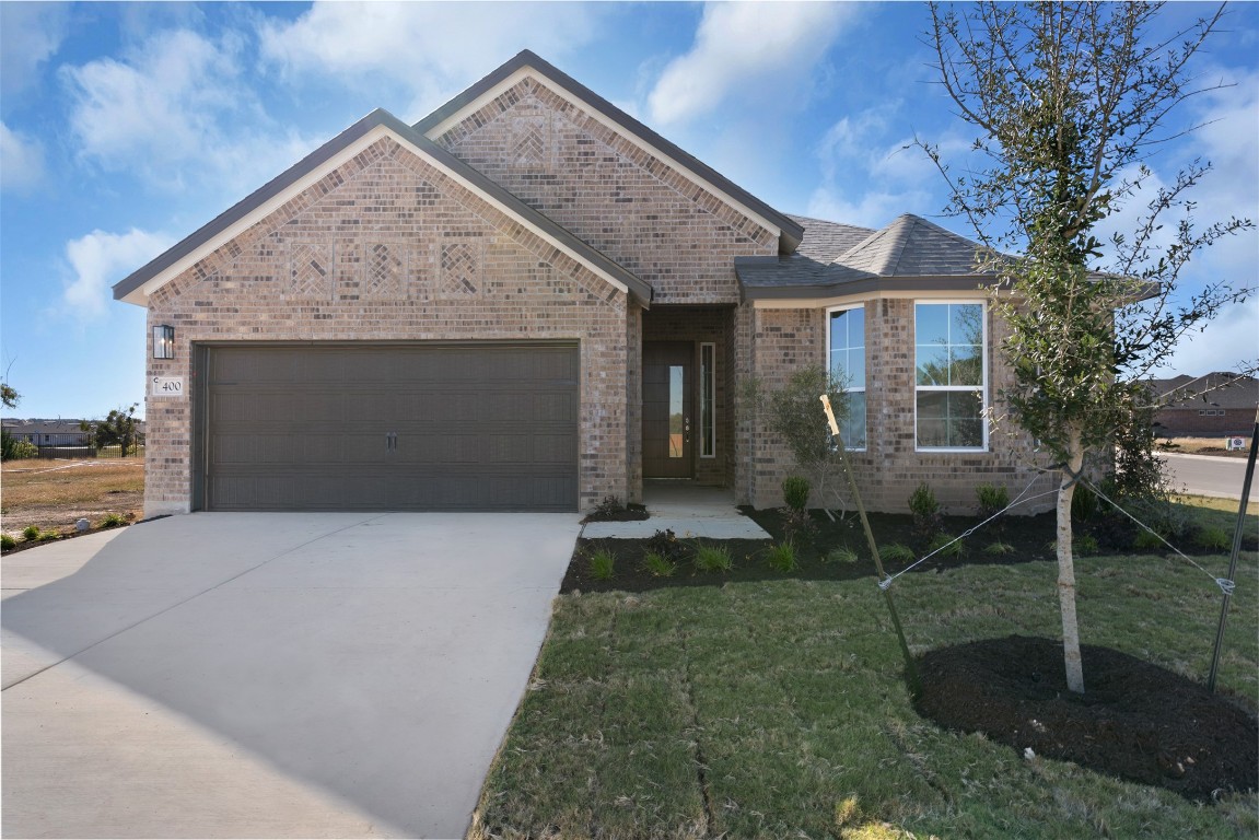 1300 Snowdrop Drive Georgetown, TX 78628 - Photo 2 of 28 a front view of a house with garden