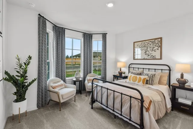 a view of a hallway with wooden floor and a chandelier