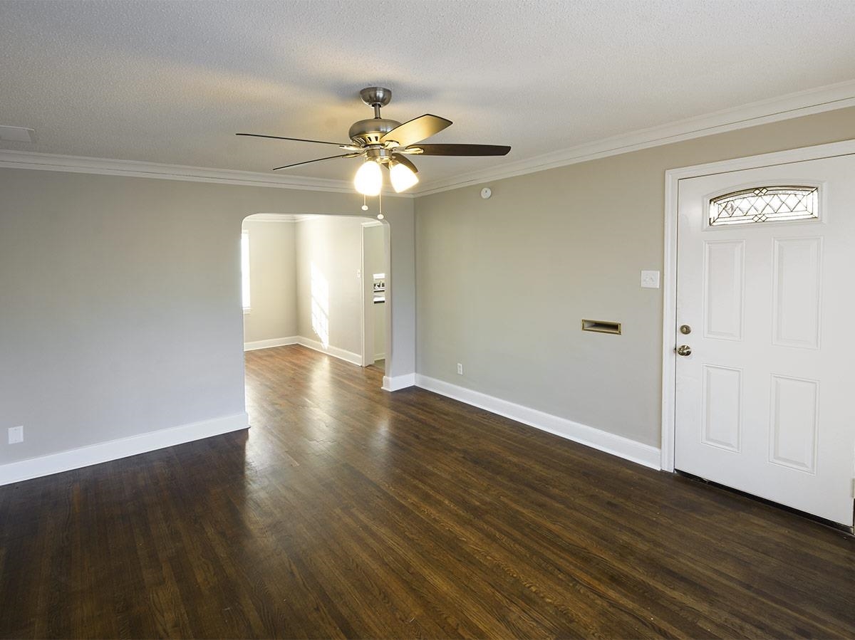 1019 Little John Road Memphis, TN 38111 - Photo 6 of 13 Entryway featuring a textured ceiling, dark hardwood / wood-style floors, and crown molding