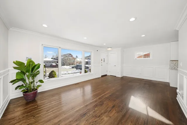 a view of a living room and wooden floor