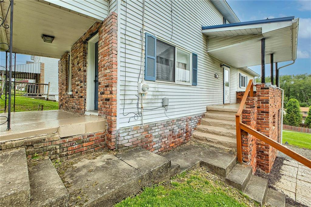 8002 Hayward Street Irwin, PA 15642 - Photo 28 of 31 a view of a house with backyard and porch