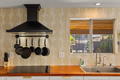 a bathroom with a sink and a window