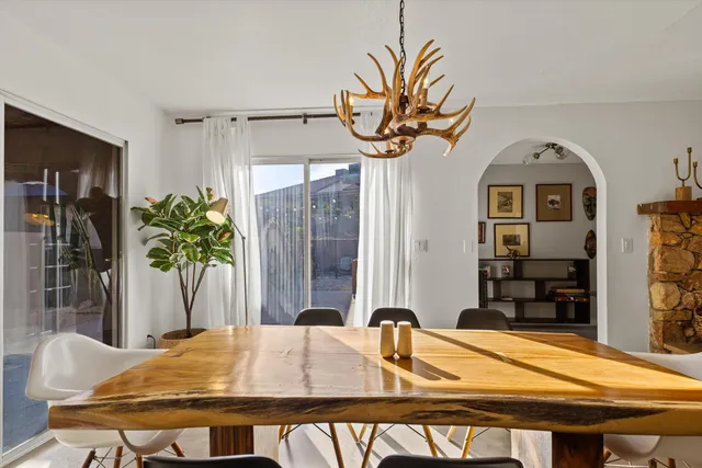 a dining room with furniture and window