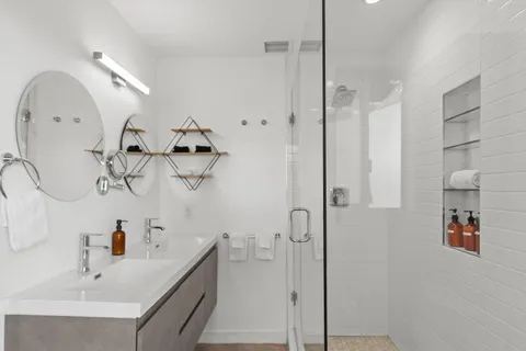 a bathroom with a sink and mirror