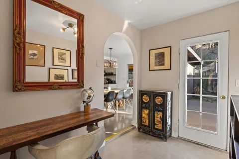 a view of a livingroom with furniture and entryway