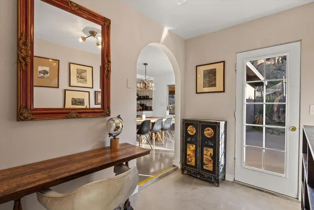 a view of a livingroom with furniture and entryway
