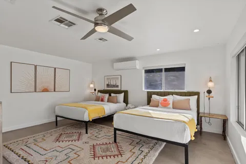 a bedroom with a bed and window