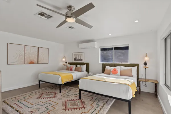 a bedroom with a bed and window