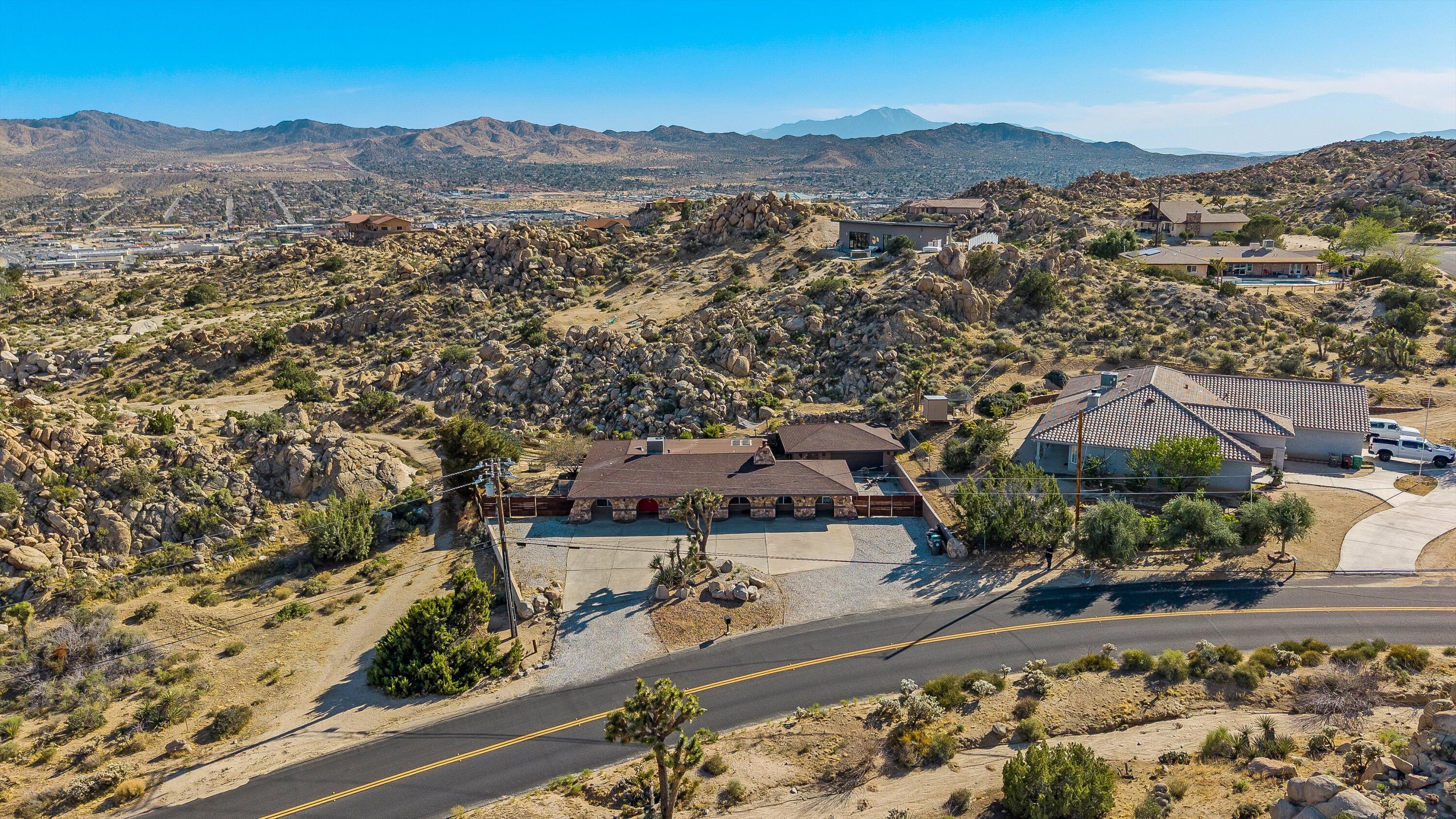57113 Farrelo Road Yucca Valley, CA 92284 - Photo 44 of 46 an aerial view of residential house and outdoor space