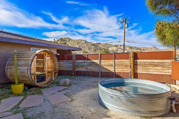 a swimming pool with outdoor seating