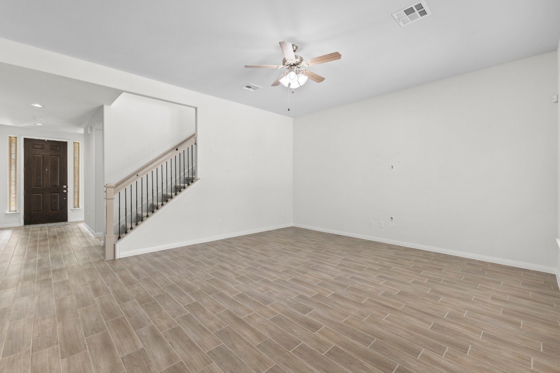 104 Scenic Hills Circle Georgetown, TX 78628 - Photo 18 of 30 a view of an empty room with wooden floor