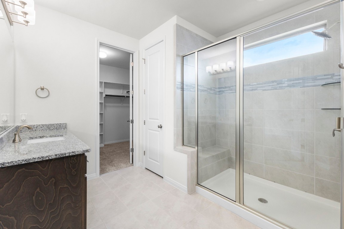 104 Scenic Hills Circle Georgetown, TX 78628 - Photo 21 of 30 a bathroom with a granite countertop shower sink and mirror