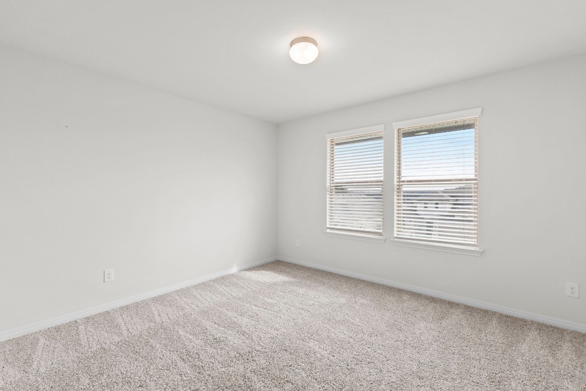 104 Scenic Hills Circle Georgetown, TX 78628 - Photo 24 of 30 a view of an empty room with a window