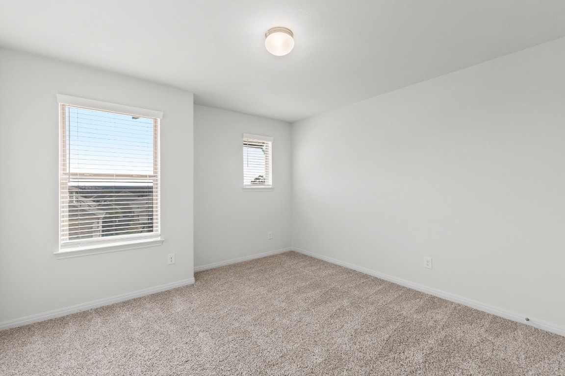 104 Scenic Hills Circle Georgetown, TX 78628 - Photo 25 of 30 an empty room with a window