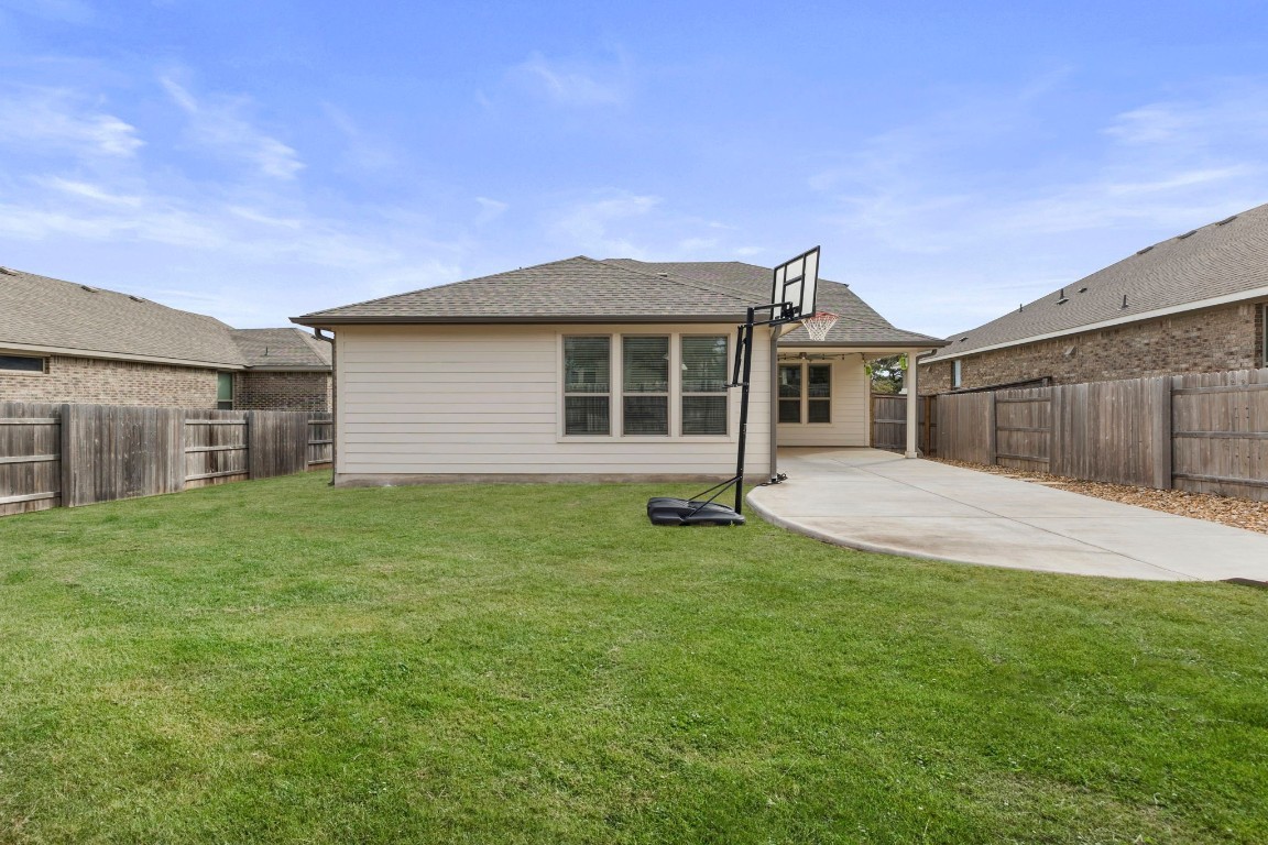 104 Scenic Hills Circle Georgetown, TX 78628 - Photo 29 of 30 a front view of a house with a garden