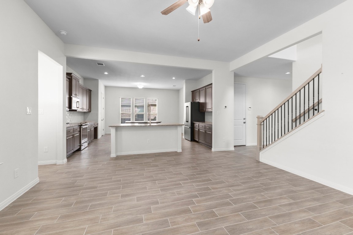 104 Scenic Hills Circle Georgetown, TX 78628 - Photo 10 of 30 a view of a kitchen with a refrigerator and a window