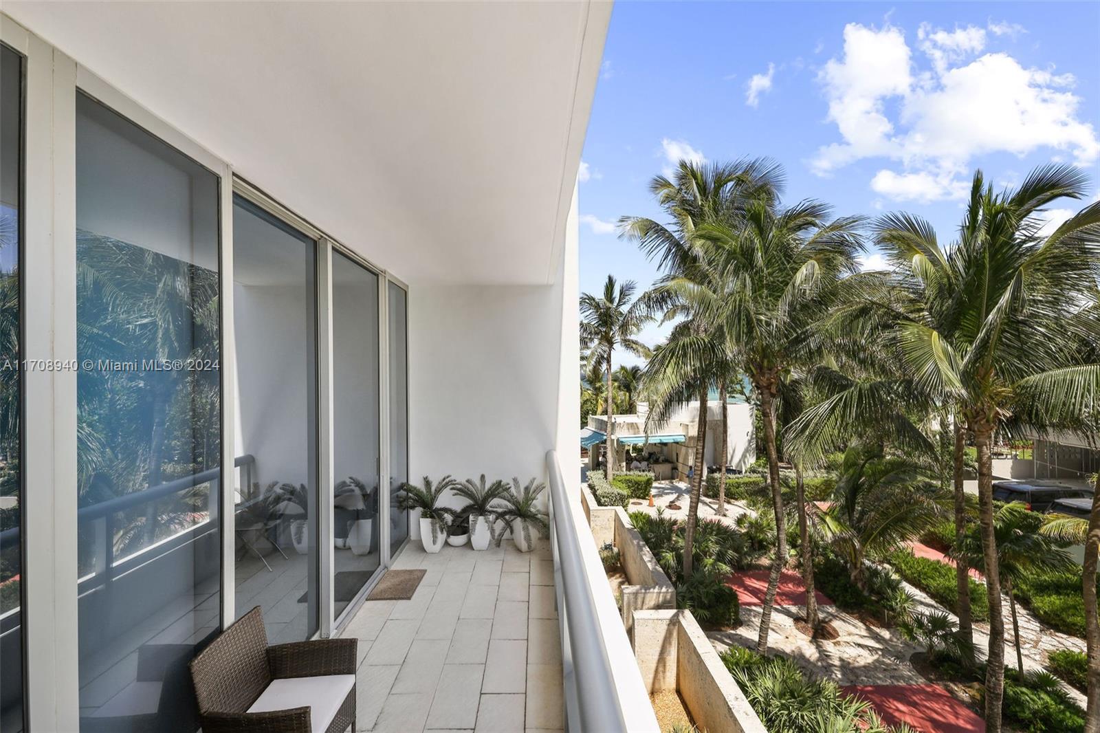 6799 Collins Avenue, Unit 207 Miami Beach, FL 33141 - Photo 16 of 35 a balcony with view of outdoor space