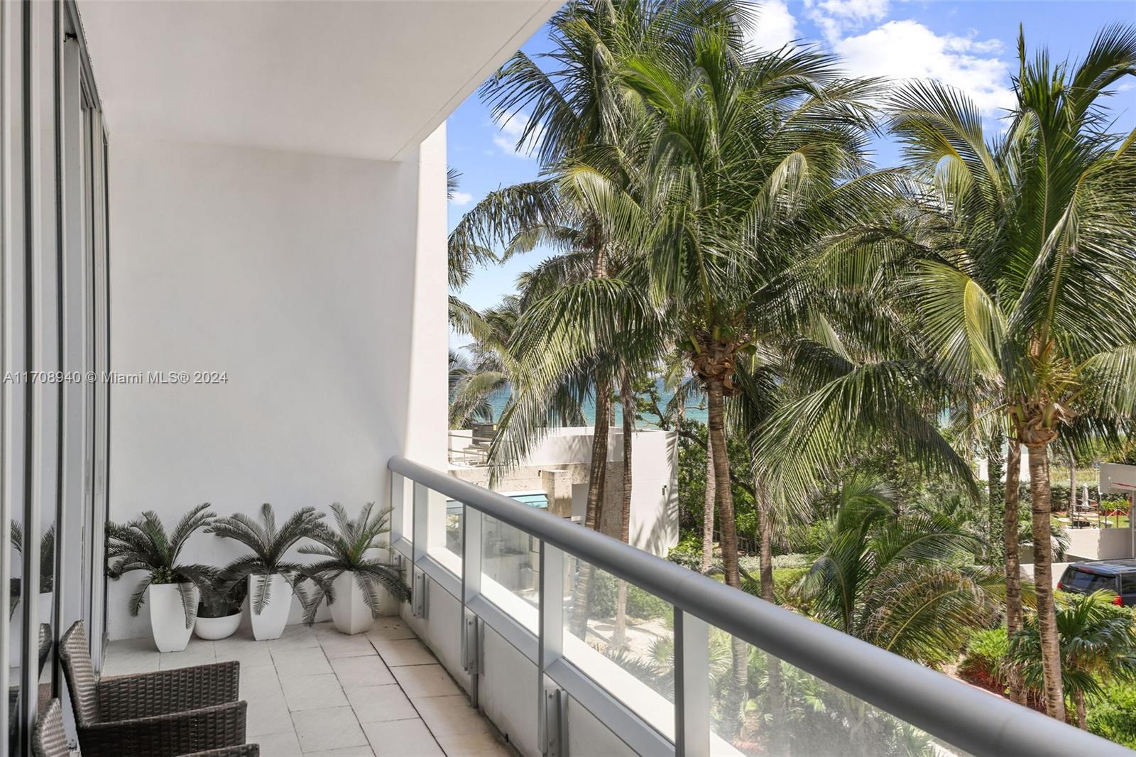 6799 Collins Avenue, Unit 207 Miami Beach, FL 33141 - Photo 2 of 35 a view of balcony with potted plants