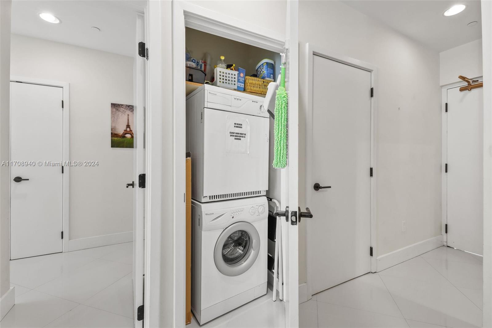 6799 Collins Avenue, Unit 207 Miami Beach, FL 33141 - Photo 23 of 35 a utility room with dryer and washer