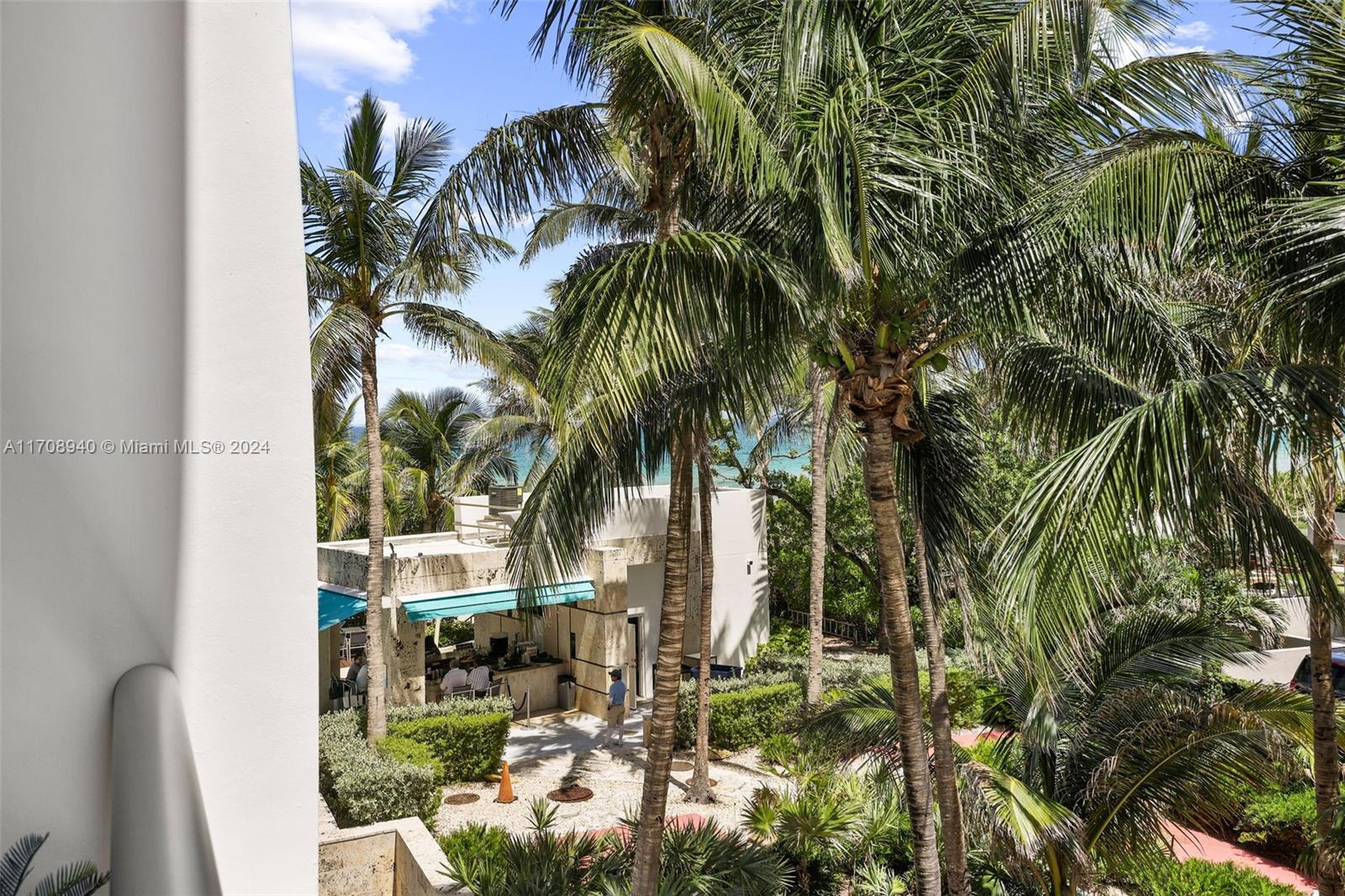 6799 Collins Avenue, Unit 207 Miami Beach, FL 33141 - Photo 25 of 35 a view of backyard of house with outdoor seating