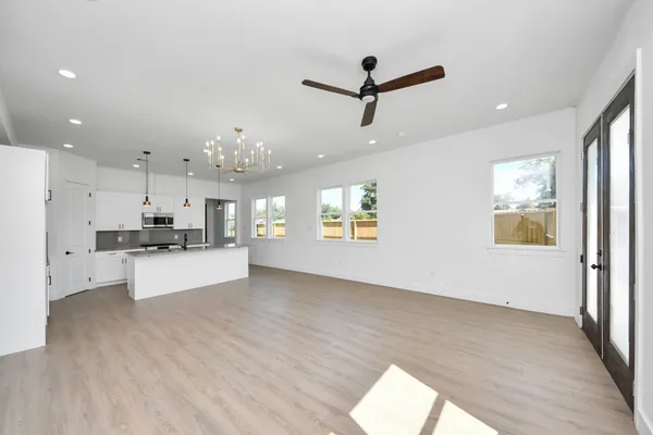 a view of a kitchen with stove and cabinets
