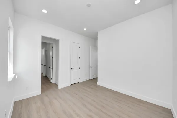 a view of a bathroom with a sink and a mirror