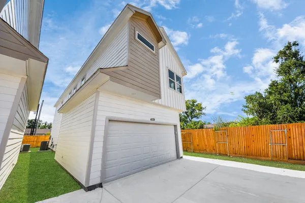 a aerial view of a house with a yard