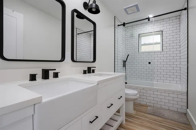 a bedroom with a bed and a television