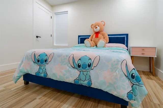 a bedroom with a bed and a closet