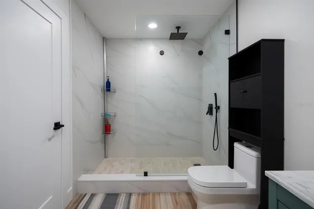 a view of room with furniture and flat screen tv