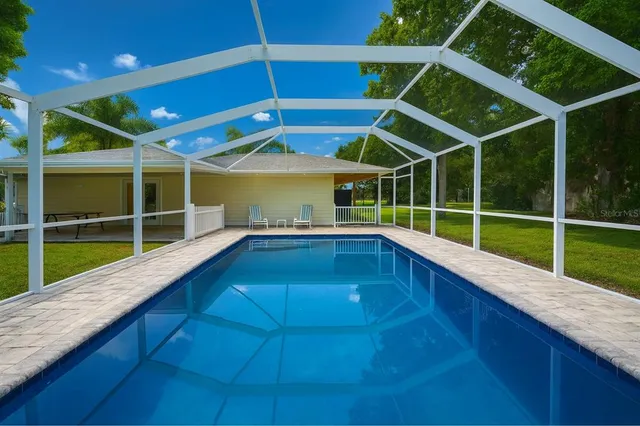a view of a house with a backyard